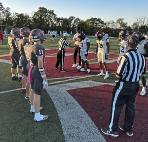Captains for Aliquippa and West Allegheny meet at midfield before their game Friday, Oct. 3, 2025.