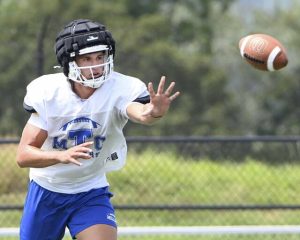 Trinity quarterback Jonah Williamson pitches the ball at practice on Friday, Aug. 8, 2025, at Hiller Stadium in North Strabane.