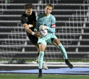 Fox Chapel goalkeeper Brady Matthews collides with Seneca Valley’s Michael Pokryzwinski while making a save during their game on Tuesday, Sept. 30, 2025, in Jackson.