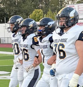 Apollo-Ridge captains take the field to face Our Lady of the Sacred Heart on Sept. 27.