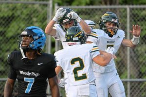 Penn-Trafford’s Colton Tyburski, Nico Casciato and Cody Yacamelli celebrate after a touchdown Sept. 12 at the Wolvarena.