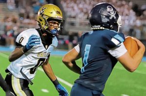 Valley's Sean Wilkerson pursues Burrell's Antonio Perkins during a long run in the first half Friday night at Burrell. Perkins scored on the play, but it was called back for holding.