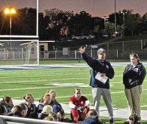Franklin Regional girls soccer coach Scott Arnold talks to his team at halftime Wednesday night. The Panthers defeated Elizabeth Forward, 5-0, in a Section 4-3A game at Panther Stadium in Murrysville.
