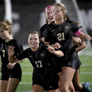 Quaker Valley’s Rowan Wallace celebrates her goal with Annabel Miko and Hope Waller during their game against Central Valley on Wednesday, Oct. 8, 2025, in Leetsdale.