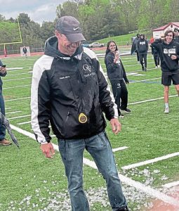 Quaker Valley track and field coach Jared Jones reacts to an ice bath administered by his team following the completion of the WPIAL Class 2A team championships on May 6 at Peters Township.