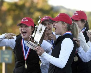 Members of the Peters Township girls golf team celebrate with the WPIAL championship trophy after winning the Class 3A title on Thursday at Cedarbrook Golf Course.