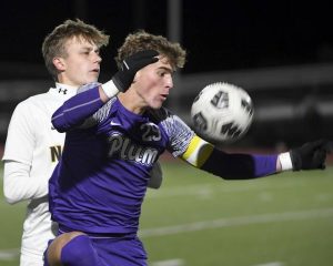 Plum’s Austin Kolankowski works against Norwin’s Alex Cella during their game on Thursday, Oct. 9, 2025, at Plum.