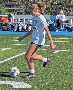 Burrell senior midfielder/defender Mikayla Coury plays the ball in practice Thursday.