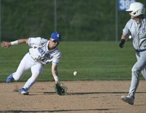 Hempfield’s Chase Sikorski scoops and throws out Canon-McMillan’s Brayden Radue on April 23.