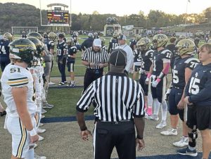 Captains from Penn-Trafford and Franklin Regional gather for the coin toss before Friday's game.