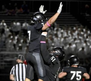 Upper St. Clair’s Dante Coury celebrates with Daniel Marshall after scoring his second touchdown against Bethel Park on Friday, Oct. 10, 2025, at USC.