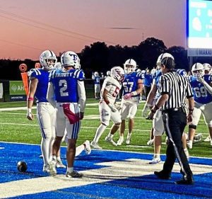Trinity's Jonah Williamson (2) and teammates celebrate after his 5-yard touchdown run during a game against Chartiers Valley on Oct. 10, 2025, at Trinity.