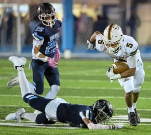Highlands' Tevin Owen-Cratsenberg (5) slips past Burrell's Vincent Scherer (2) as he fights for extra yards on Friday, Oct. 10, 2025, at Burrell.