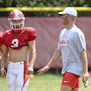 Fort Cherry head coach Tanner Garry talks with quarterback Matt Sieg during practice on Thursday, Aug. 15, 2024, at Fort Cherry.