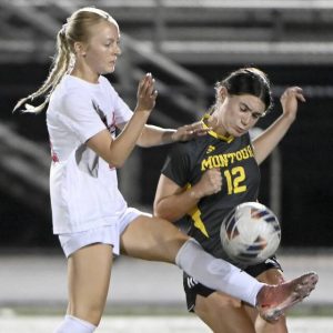 Montour’s Brynn Kaczmarek battles Moon’s Taylor McConnell for possession during their game on Wednesday, Sept. 17, 2025, in Robinson.