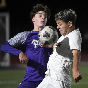 Norwin’s Maksim Miller battles Plum’s Landon Vasil for possession during their game on Thursday, Oct. 9, 2025, at Plum.