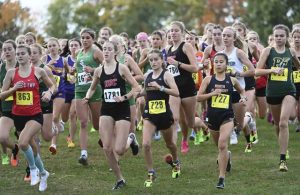 The Class 3A girls field begins the 2023 Tri-County meet 
at White Oak Park.