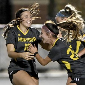 Montour’s Irelynn Hobbs celebrates with teammates after scoring on a penalty kick against Moon on Sept. 17.