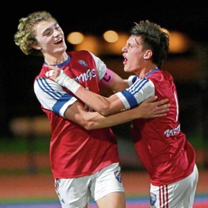 Mt. Pleasant’s Grant Zahrobsky (left) celebrates his goal with Tyke Snyder during their game against Charleroi.