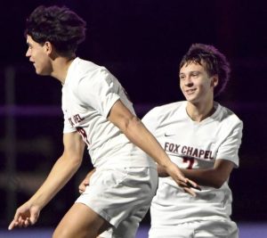 Fox Chapel’s Rocco Poli celebrates with Carson Torres after the Foxes scored against Seneca Valley on Sept. 30.