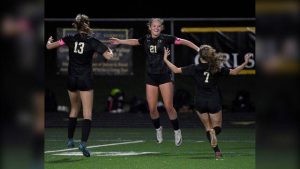 Quaker Valley’s Annabel Miko celebrates her second goal with Emma Currier (13) and Eliza Rohm during their game against Central Valley on Oct. 8.
