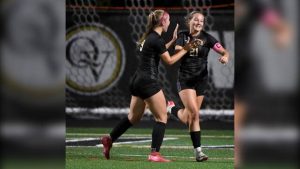 Quaker Valley’s Annabel Miko celebrates her first goal with Hope Waller during their game against Central Valley on Oct. 8.