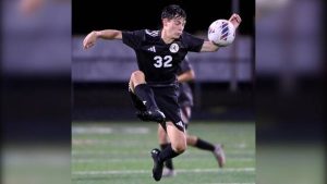 Quaker Valley’s Asher Muretisch moves the ball upfield against Hopewell on Oct. 7.