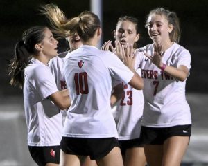 Peters Township’s Brynn Busch (7) celebrates with Mandy Pirosko (10) after scoring against Mt. Lebanon during their game on Monday, Oct. 6, 2025, in Mt. Lebanon.