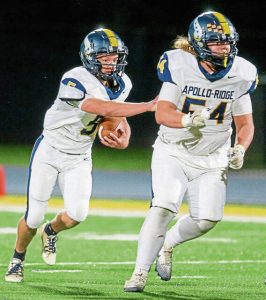Apollo-Ridge’s Zach Myers runs behind Gino McCullough against South Allegheny last Friday.