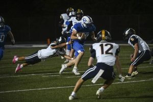 Apollo-Ridge’s Avery Grant leaps to attempt a tackle against South Park on Friday at South Park.