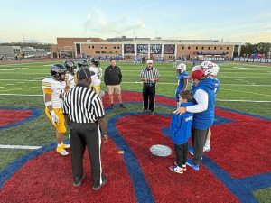 Players from Thomas Jefferson and Chartiers Valley meet at midfield for the coin toss before their game Oct. 17, 2025, at Chartiers Valley.