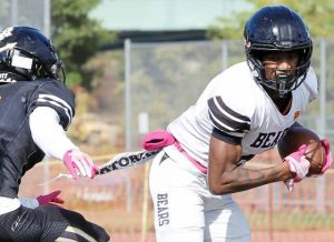 Clairton receiver Brandon Murphy looks to maneuver past Riverview's Max Kratt during the first half of the Bears' 66-0 win over Riverview Saturday at Riverside Park in Oakmont. Murphy finished with 91 receiving yards and scored twice.