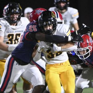 Thomas Jefferson’s Tyler Eber carries McKeesport’s Makai Daniels for extra yards during the fourth quarter on Friday, Sept. 5, 2025, at McKeesport.