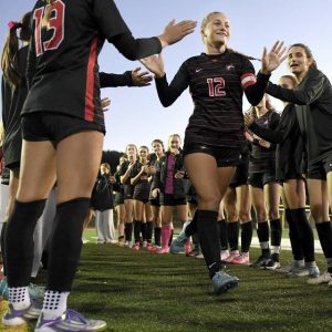Fox Chapel’s Emily McKee takes the field past her teammates during player introductions before their game against Norwin on Wednesday.