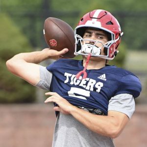 Moon quarterback Andrew Cross throws a pass on Wednesday, Aug. 6, 2025, at Tiger Stadium in Moon.
