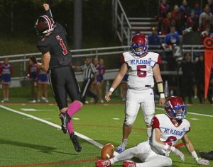 Southmoreland’s Stanley Chapman celebrates after dropping Mt. Pleasant’s Richard Shawley for a loss Oct. 6.