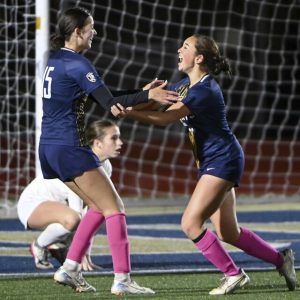 Norwin’s Leesia Phetsomphou celebrates with Gianna Marts after scoring with 46 seconds remaining in double overtime during their WPIAL Class 4A quarterfinal against Mt. Lebanon on Thursday, Oct. 23, 2025, at Norwin.