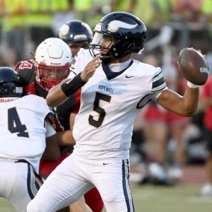 Hopewell quarterback James “Booboo” Armstrong throws a pass against Avonworth on Sept. 19.