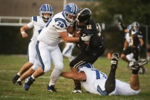 Leechburg defender Geno Granata (70) tackles Riverview’s Connor Kmetz on Friday, Sept. 12, 2025 at Riverside Park in Oakmont.