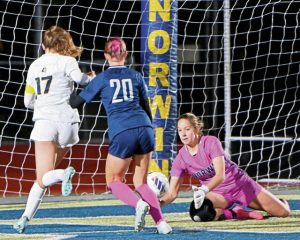 Norwin goalkeeper Rebecca Kostrobala makes a save against Mt. Lebanon during overtime in their WPIAL Class 4A quarterfinal on Thursday, Oct. 23, 2025, at Norwin.