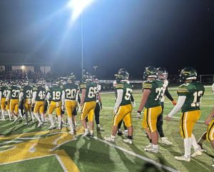 Players from Penn-Trafford and Latrobe shake hands after the Warriors' victory Friday night.