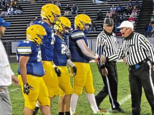 Derry players head to midfield for the coin toss before their game against Yough on Friday.