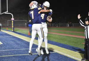 Norwin’s Ben Markel celebrates with Zack Pawling after Pawling’s touchdown against Mt. Lebanon on Friday.