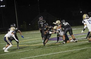 Anthony Portis (9) of Imani Christian runs against Freeport on Friday.