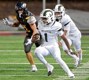 Pine-Richland quarterback Oobi Strader carries against Central Catholic on Aug. 29.