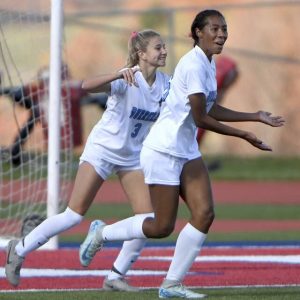 Burrell’s Makiah Buchak celebrates her first goal next to McKenna Miller during a WPIAL Class 2A quarterfinal against Mt. Pleasant last season.