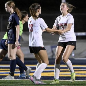 Peters Township’s Brynn Busch (7) celebrates with Marina Hajnosz after scoring against Mt. Lebanon during their game on Monday, Oct. 6, 2025, in Mt. Lebanon.