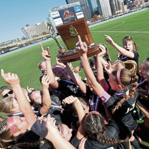 The Quaker Valley girls soccer team celebrates with the WPIAL championship trophy after defeating Burrell, 2-1, in the Class 2A final on Saturday, Nov. 2, 2024, at Highmark Stadium.