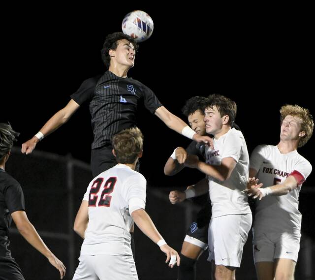 Seneca Valley’s Chase Lively heads the ball away off a corner kick against Fox Chapel on Sept. 30.