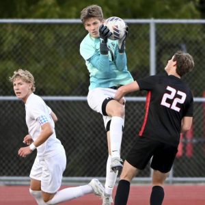 Seneca Valley goalkeeper Chase Good makes a save over Fox Chapel’s Shaif Zureikat on Sept. 9.